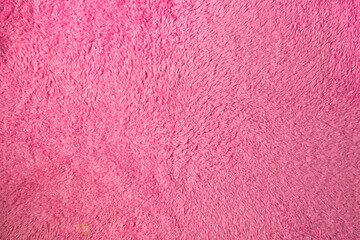 Texture of fluffy pink material as background for your image. Soft fabric surface