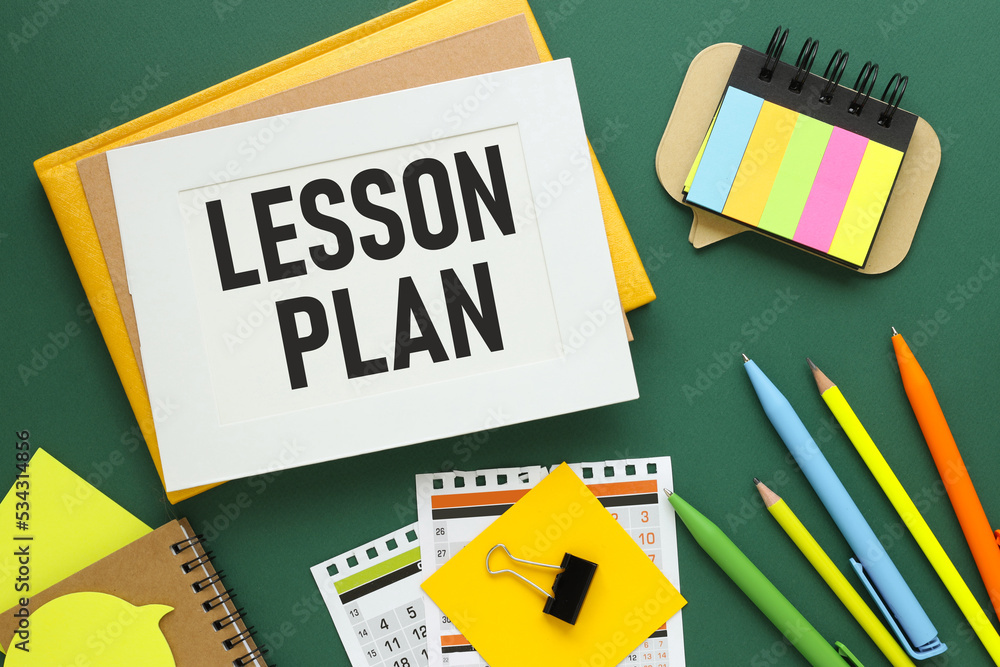 Poster lesson plan. word on a sheet for notes with a calendar in the background.information concept
