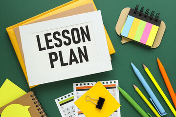 Lesson Plan. Word on a sheet for notes with a calendar in the background.Information concept