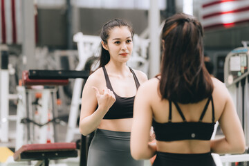 Fototapeta na wymiar Asian female fitness athlete in gym