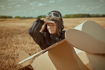 pilot in cardboard plane