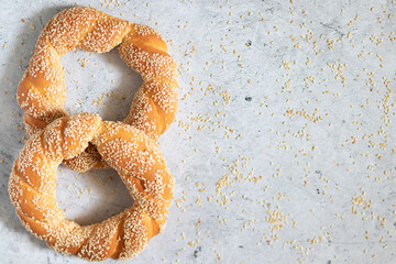 Simits,Turkish bagels with sesame, on light concrete background with copyspace