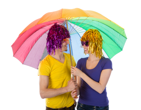 Trendy couple with sunglasses and wigs covered under a rainbow unbrella isolated on transparent background
