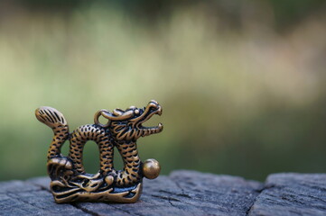 Dragon figurine close-up. Chinese symbol. Esotericism and feng shui.