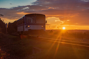 Czech passenger old train with sunset near Rakovnik town in central Bohemia