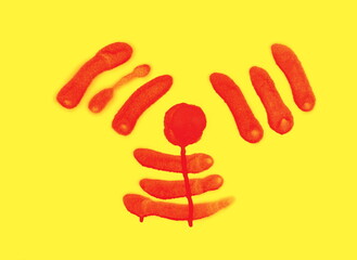 Red spray stain in shape radiation symbol on yellow background