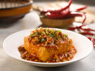 Tofu with Spicy Minced Pork and Sweet Turnip served in a dish isolated on table side view