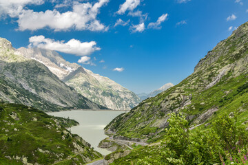 View on traffic next to Raterischbodensee lake on Grimselpass