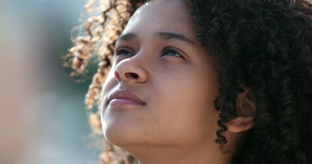 Child face looking at sky, close-up kid looks up