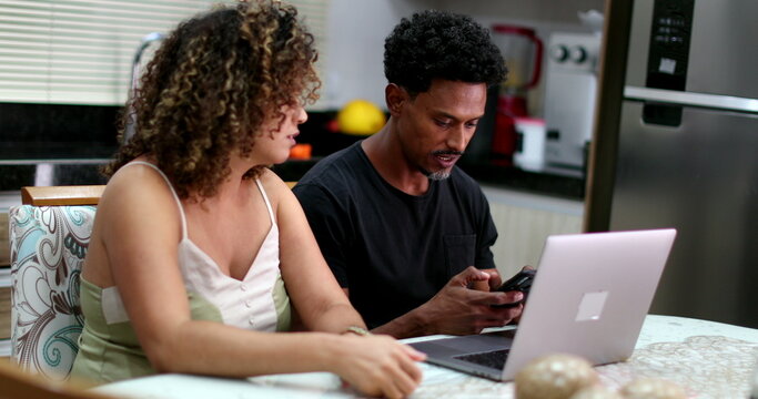 Candid Black Couple Doing Money Budget Together In Front Of Computer Laptop