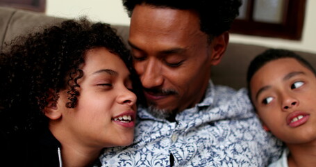 Candid Brazilian father with kids. African descent parent and children