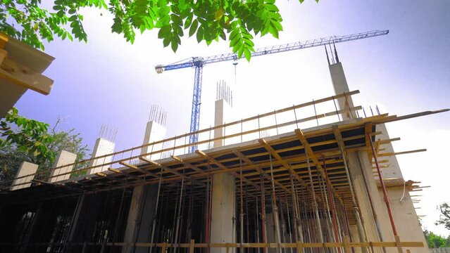 mounts on monolithic structure. Construction concept. Supports of monolithic floor formwork at construction site. Telescopic props for concrete flooring. Construction of modern apartment building