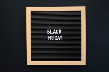 Black friday sign on letter board over black background
