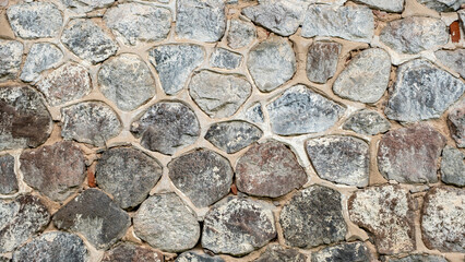 Close up stone and mortar wall for background.