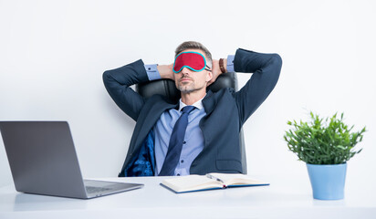 tired entrepreneur relax in sleep mask at workplace