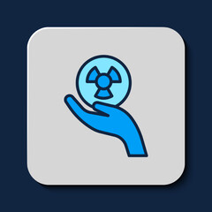 Filled outline Radioactive in hand icon isolated on blue background. Radioactive toxic symbol. Radiation Hazard sign. Vector