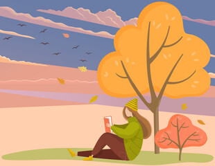 Woman reads book outdoors in autumn park sits at tree. Leisure and education. Concept of relaxation with reading literature in garden. Girl relaxing in natural background. Student reads textbook