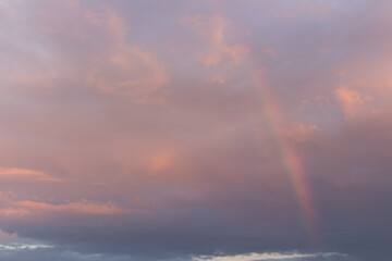 Fototapeta na wymiar Rainbow in the cloudy sky