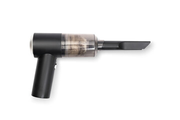 Isolated small handheld vacuum with pet fur and debris in storage compartment. Bagless portable mini vacuum to clean or dust small spaces such as keyboards, electronics, cars. Selective focus.