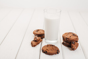 A glass of milk and biscuits for breakfast. Benefits of milk