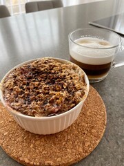 morning porridge with muesli and cupuccino oatmeal on the table