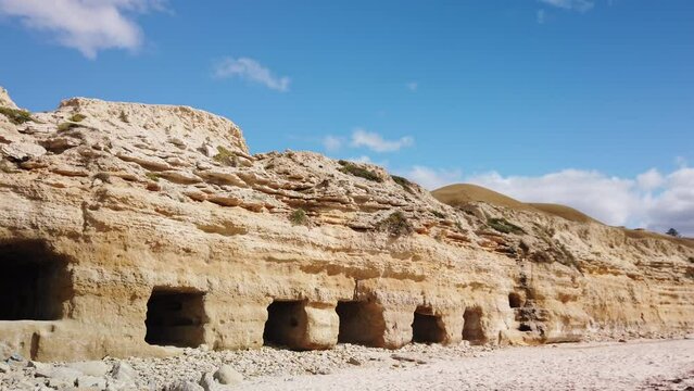 Port Willunga historic beach caves carved out by fisherman to store boats and nets, Left to right pan, Fleurieu Peninsula, South Australia,Australia