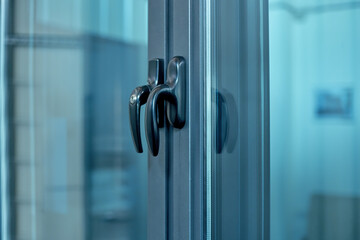 close-up. metal handle on the glass door.