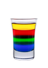 Colored water layers in a shot glass isolated on white background