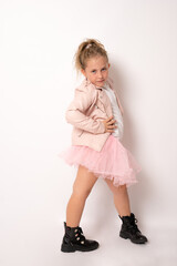 Portrait of attractive cheerful girl standing enjoying pastime isolated over pink pastel color background