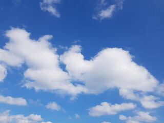 Naklejka na ściany i meble blue sky with fluffy, white clouds