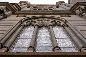 Low angle shot of a vintage building with ancient architecture © Damián Méndez/Wirestock Creators