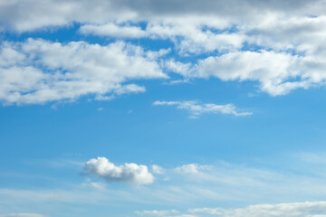 Fototapeta na wymiar Blue sky with white clouds. Beautiful cloudy sky. Skyward. Endless skyline. The sky at dawn.