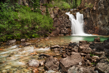 Fototapeta na wymiar USA, Colorado, Gunnison National Forest. Waterfall and pool on Crystal River.