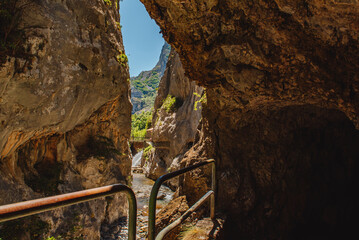 Cares river gorge route. Hiking trail in Picos de Europa National Park, Spain. Mountain path between impressive cliffs