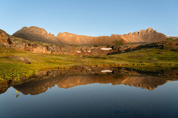 USA, Colorado, Uncompahgre National Forest. Three Needles mountains reflect in mountain pond.