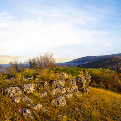 Fototapeta na wymiar mountain valley with grass plateau at the sunset