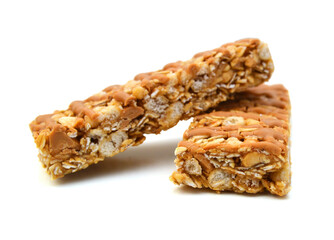 Honey bars with peanuts on white background