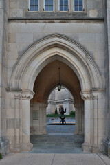 Fototapeta na wymiar Usa, District of Columbia. Washington National Cathedral, arched entry to the Cathedral Garth. The Garth is enclosed by the cloister, the cathedral and the administration building.
