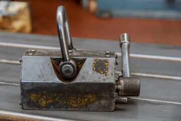 Industrial lifting magnet for lifting metal products in production.