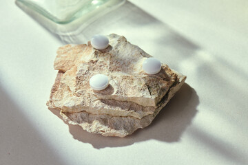 Medicine pills with natural beige background and props. Antipyretic, antibiotic, aspirin, antiviral or vitamine tabs. Health care and medicine concept... Check my profile for more!