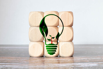 Save energy symblos icon on wooden cubes. Ecology environmentally friendly concept. Net zero actions.