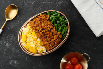 Three Color Japanese Rice Lunchbox with Stir Fry Minced Chicken, Boiled French Beans, and Scramble Eggs.