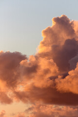 Beautiful dramatic sunset cloudscape with fluffy clouds over clear sky
