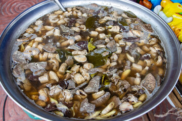 The Spicy Soup with Pork Giblets in a large pot at market, Thailand