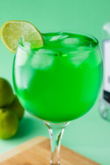 green cocktail with lime