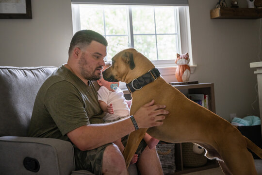 Marine veteran with service dog and family living life.