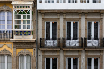 Beautiful fasade of the building in European style, small balconies.