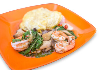 Top view of Rice topped with stir-fried shrimp and basil, focus selective