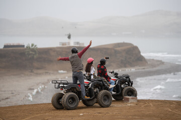 Friends taking selfie during an excursion with quad bikes © Guillermo Spelucin