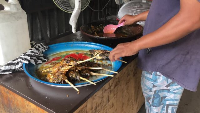 Process of making Ikan Bakar. Ikan Bakar (Grilled Fish) is an Indonesian and Malaysian dish, prepared with charcoal-grilled fish or other forms of seafood.